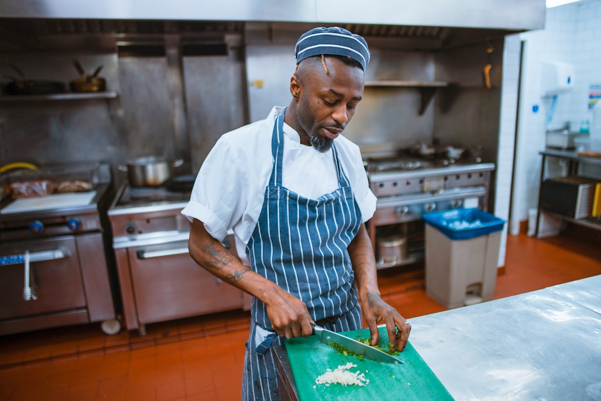 Man preparing healthy meal with fresh vegetables and protein